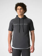 A man wearing a dark gray short-sleeve hoodie with 'DISTINCT ONE' printed in light gray across the chest, paired with dark gray pants, against a light gray studio background.